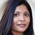 A woman in a white shirt with black hair.