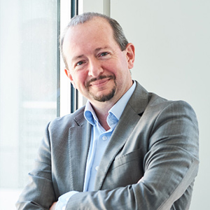 A man in a gray suit.